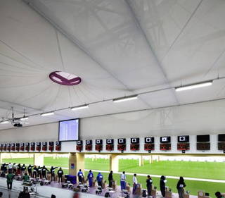 Illustration for article titled Technicolor Bullet Holes Make This the Perfect Home for Olympic Shooting